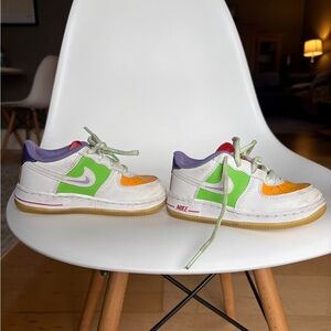 Nike Kids White Sneakers with Green, Orange & Purple Accents